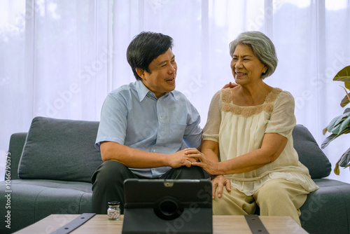 Mother and son video call to doctor.