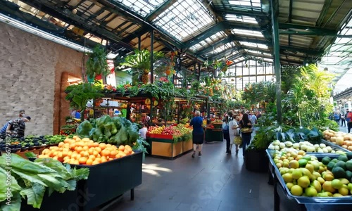 Vibrant indoor market filled with fresh fruits and vegetables.