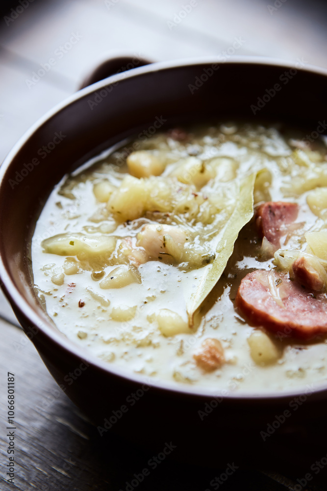 Cabbage soup on wooden background. Close up. 