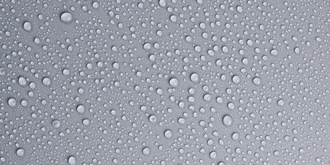 Textured gray background with clear water drops, background for design or text. Top view. Free space.