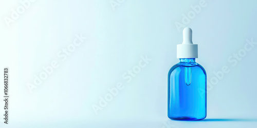 A blue bottle with a white cap sits on a white background