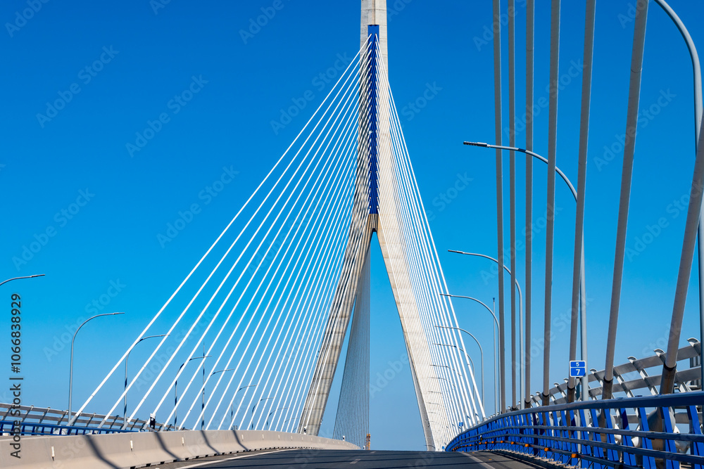 Obraz premium View on cable-stayed bridge with high pylons across the Bay of Cadiz, linking Cadiz with Puerto Real in mainland Spain