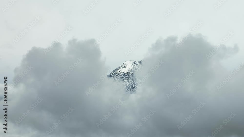 Nevado de Colima Peak seen through the gap in clouds, high altitude view Nevado de Colima Peak seen through the gap in clouds, high altitude view