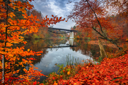 Autumnal scenery and the railway bridge in Rutki, Kashubia. Poland photo