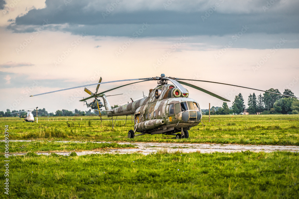 Fototapeta premium Old military helicopter at airbase field