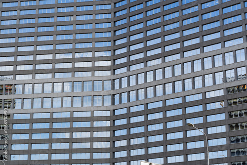 Obraz na płótnie The Reflection of Modern Architecture Seen in a Beautiful Glass Facade of a Building w salonie