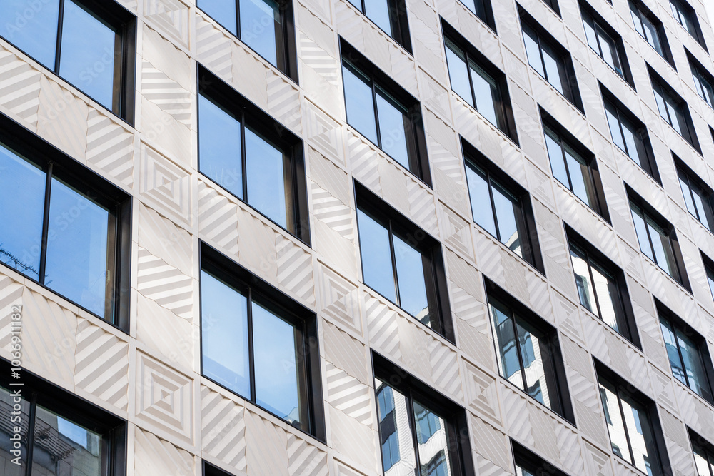 Modern Urban Architecture Showcased Among Tall Buildings Beneath a Blue Sky