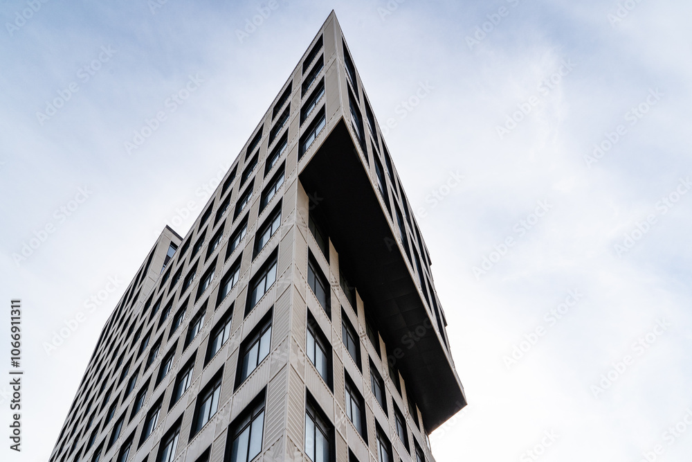 Modern Urban Architecture Showcased Among Tall Buildings Beneath a Blue Sky
