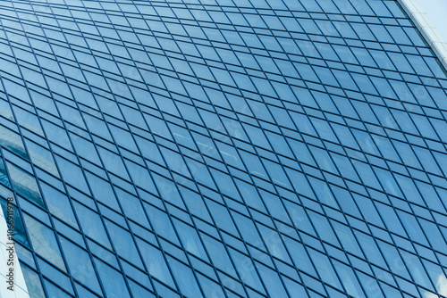 Obraz na płótnie The Reflection of Modern Architecture Seen in a Beautiful Glass Facade of a Building w salonie