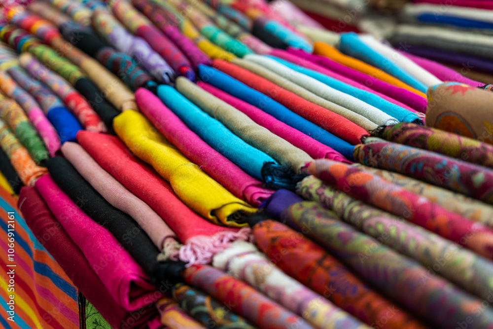 A Colorful Collection of Beautifully Rolled Textiles Arranged in a Vibrant Market Display