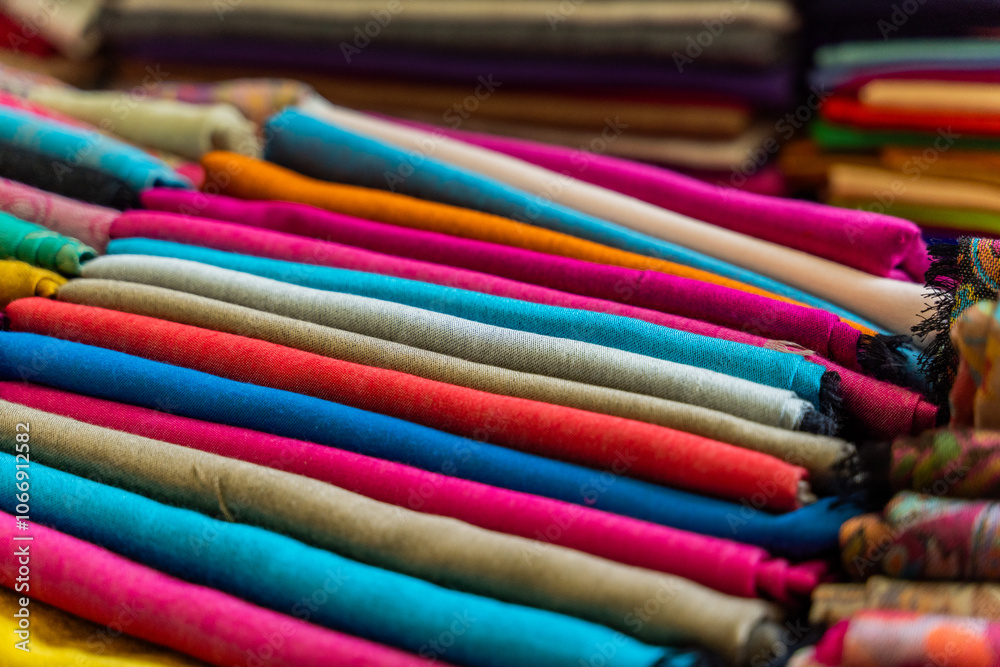 A Colorful Collection of Beautifully Rolled Textiles Arranged in a Vibrant Market Display
