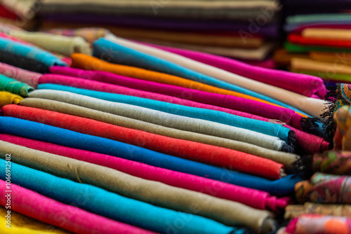 A Colorful Collection of Beautifully Rolled Textiles Arranged in a Vibrant Market Display