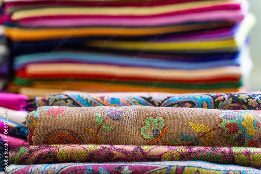 A Colorful Collection of Beautifully Rolled Textiles Arranged in a Vibrant Market Display