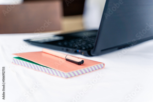 Business computer office desk with desktop laptop, notebook, pen. Office table concept.