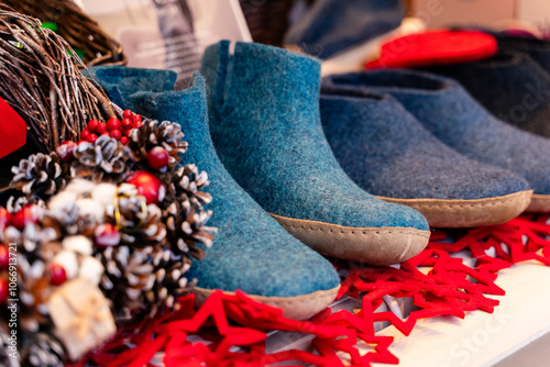 Obraz na płótnie Handcrafted Cozy Blue Shoes Designed Specifically for Winter Decor and Seasonal Styling w salonie
