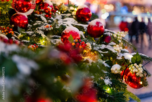 Obraz na płótnie Festively decorated Christmas setting featuring bright red ornaments and a snowy background w salonie