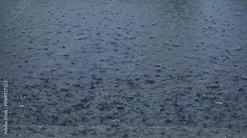 Rainwater falls onto the cement floor. Rainwater inundates roads