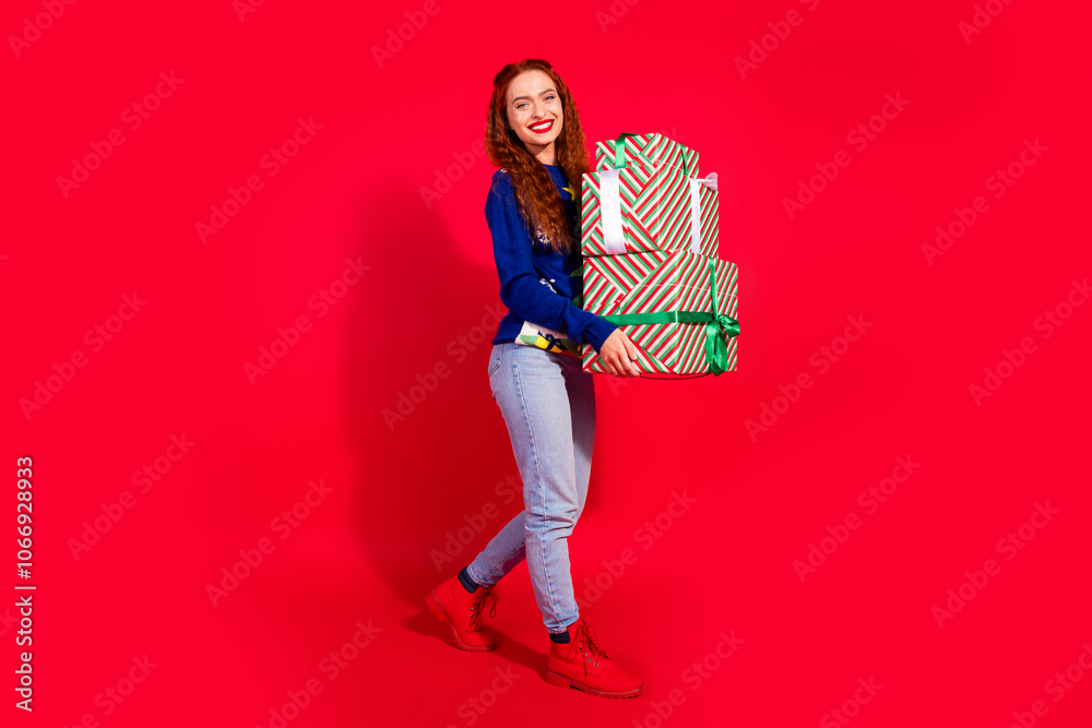 Full length photo of shiny attractive lady dressed ornament pullover enjoying getting x-mas presents empty space isolated red color background Full length photo of shiny attractive lady dressed ornament pullover enjoying getting x-mas presents empty space isolated red color background