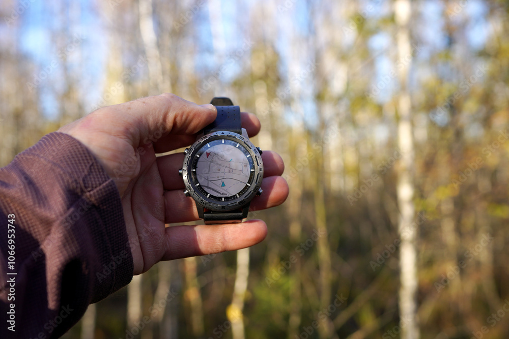 Smartwatch travel. Hiker checking map on tactical watch. Expedition smartwatch. Watch for survival. Outdoor, hiking Watch. GPS track in Smartwatch. Traveler with watch in hand in adventure. Compass. Smartwatch travel. Hiker checking map on tactical watch. Expedition smartwatch. Watch for survival. Outdoor, hiking Watch. GPS track in Smartwatch. Traveler with watch in hand in adventure. Compass.
