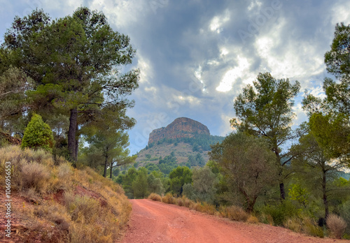 Mountain road. Old Fall River Road Scenic Drive in Sierra Calderona Mountain National Park. Popular trip, hiking trails in mountains of Valencia at foothills Gilet. Mountain road to Mola De Segart. photo