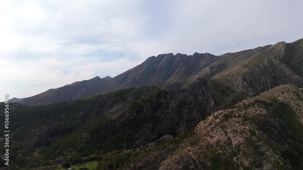 Drone flys left, showcasing the majestic Sierra de la Ventana's peaks and valleys - Buenos Aires, Argentina Drone flys left, showcasing the majestic Sierra de la Ventana's peaks and valleys - Buenos Aires, Argentina