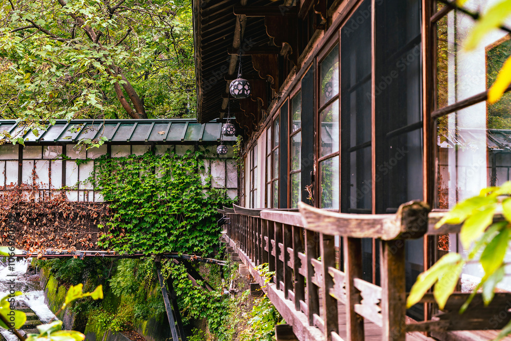 Historic Sekizenkan Ryokan's Covered Corridor Bridge Over River, Surrounded by Greenery: A Designated National Heritage from Early Showa (1930s) Period (Shima Onsen, Gunma, Japan – October 2024) Historic Sekizenkan Ryokan's Covered Corridor Bridge Over River, Surrounded by Greenery: A Designated National Heritage from Early Showa (1930s) Period (Shima Onsen, Gunma, Japan – October 2024)