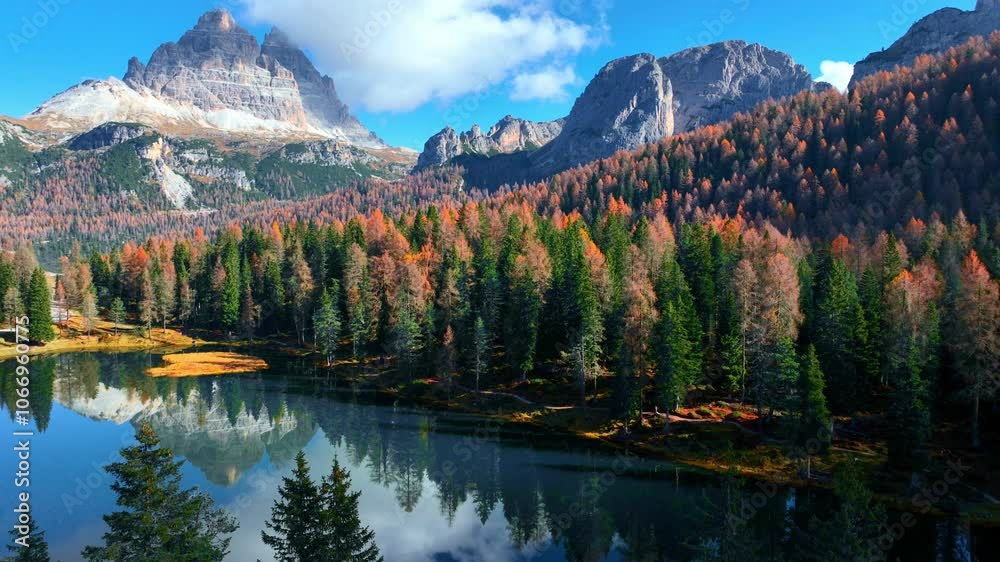 Lake Antorno in autumn in the Dolomites in Italy, aerial view of beautiful lago di Antorno in the Dolomite mountains, drone view of Tre Cime di Lavaredo national park in Italy in the fall