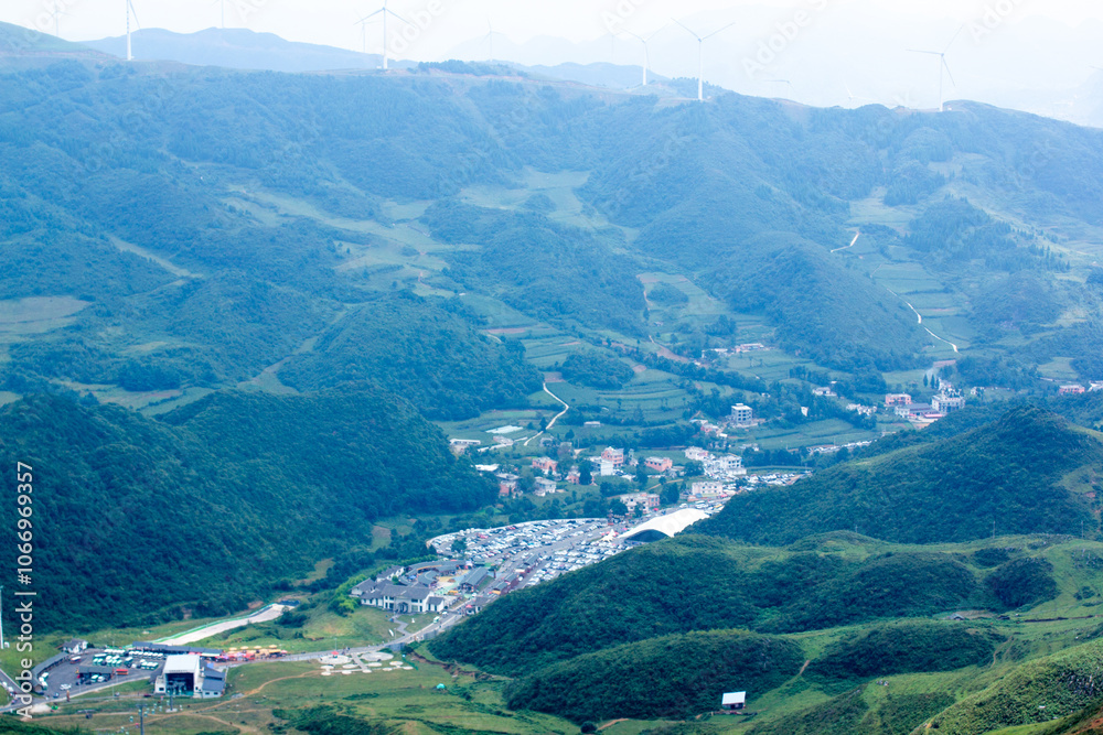 Fototapeta premium A Green Mountain with A Road Going Through lt