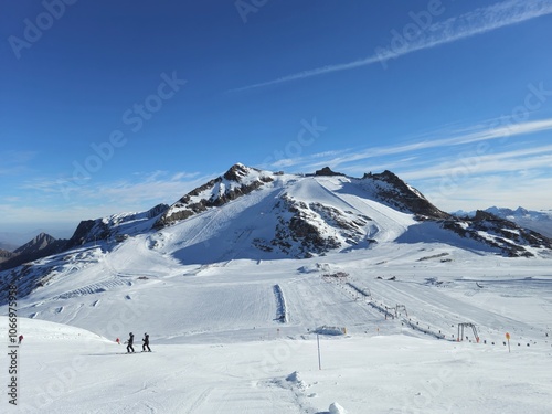 Ski resort in the mountains. Sunny day on Hintertuxer Glacier in Austrian Alps. photo