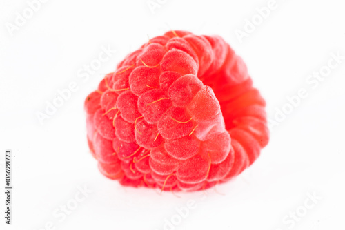 Close-up of raspberry fruit, one and several.