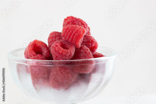 Close-up of raspberry fruit, one and several.