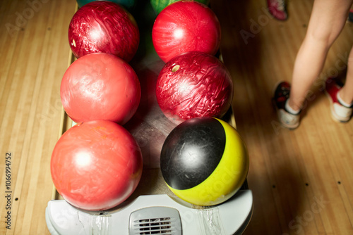 Bowling balls lie on a stand close-up. bowling balls. Bowling game. Bowling balls lie on a stand. Bowling moon bowl.