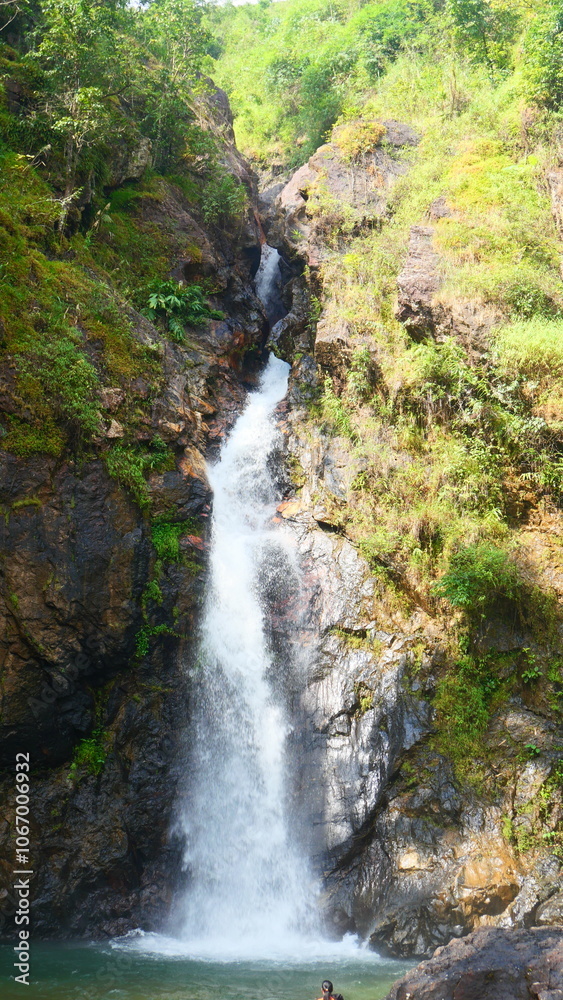 A waterfall in the middle of a forest in western Thailand A waterfall in the middle of a forest in western Thailand