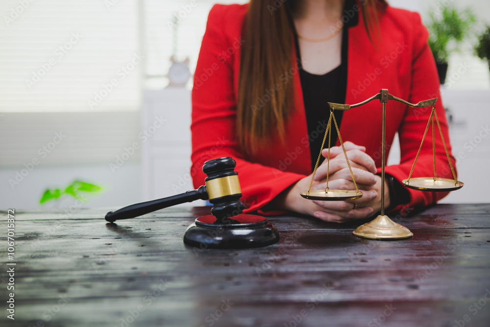 Obraz premium A dedicated Asian female lawyer who reviews legal documents and handles complex cases with expertise. Her professionalism and commitment reflect her commitment to justice and success.