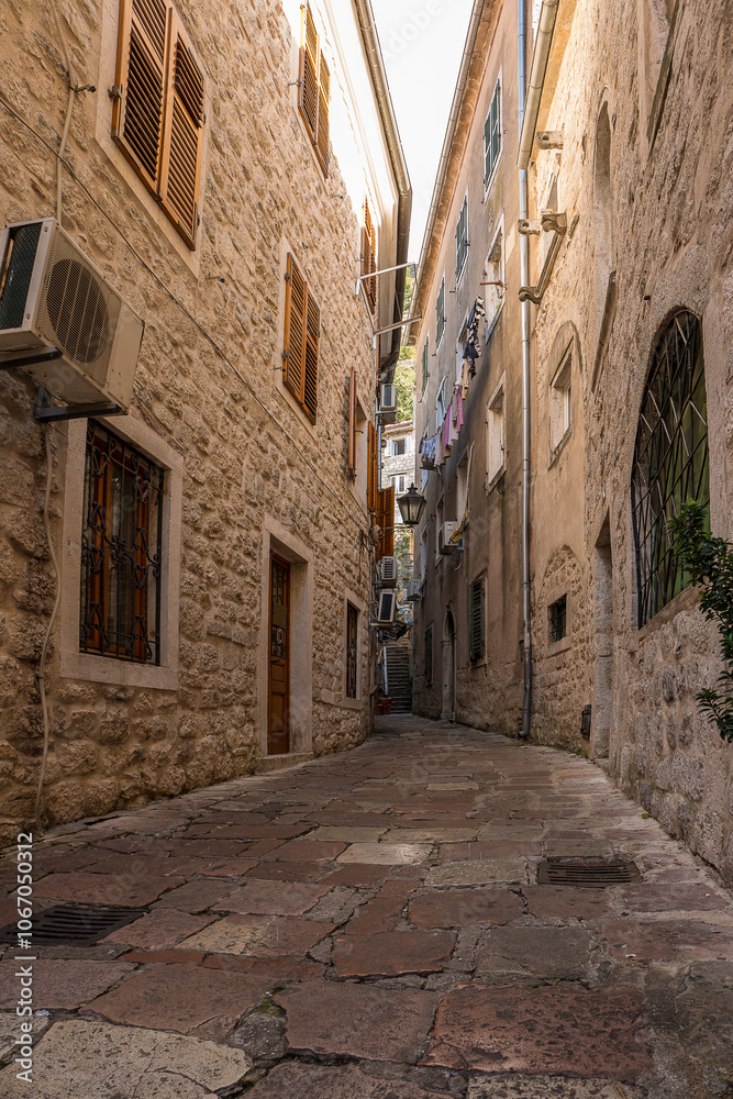 Fototapeta premium Picturesque medieval street in the old town district of the coastal city of Kotor