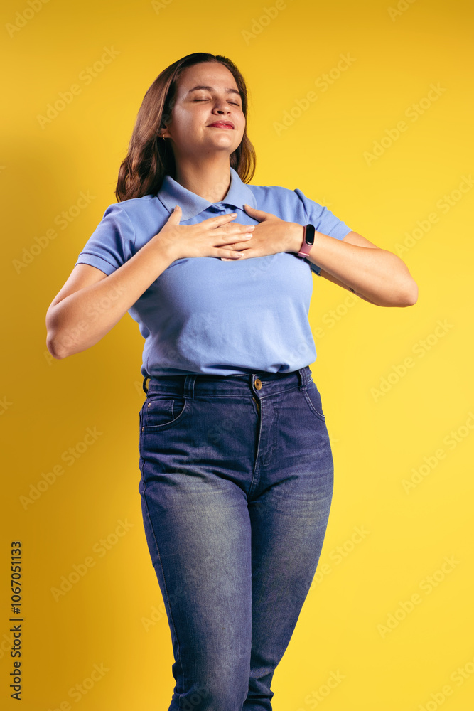 Portrait of a Brazilian woman, wearing a polo shirt and jeans Portrait of a Brazilian woman, wearing a polo shirt and jeans