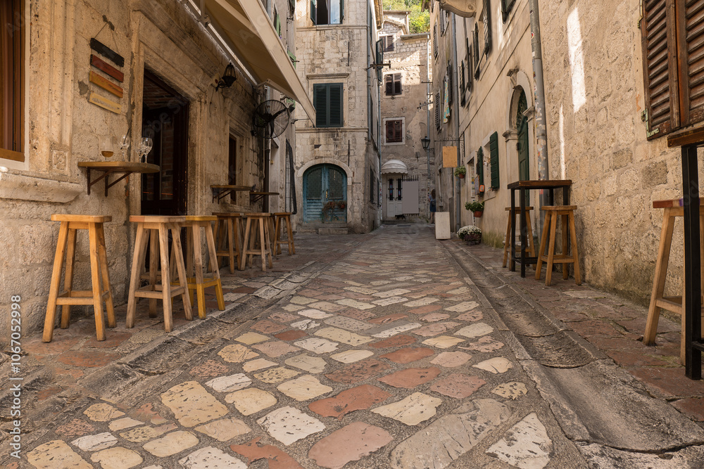 Fototapeta premium Picturesque medieval street in the old town district of the coastal city of Kotor