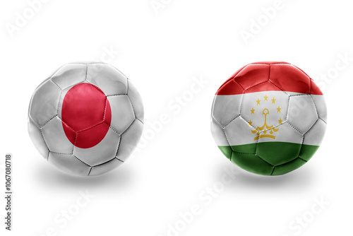 football balls with national flags of tajikistan and japan ,soccer teams. on the white background. photo