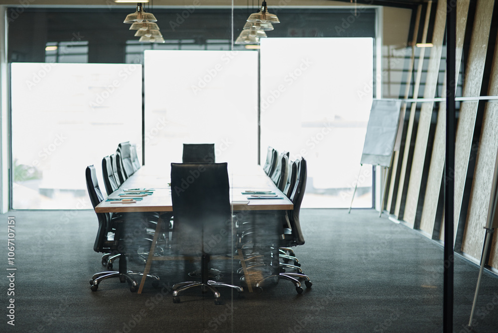 Fototapeta premium Business meeting, boardroom or corporate workplace with comfort and ergonomics. Interior design, furniture or window with luxury chair, empty and table with office space inside or presentation