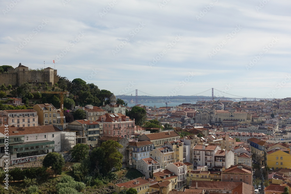 Fototapeta premium Lisbon, Portugal - July 8 2024 - Lisbon historic center view from the hill