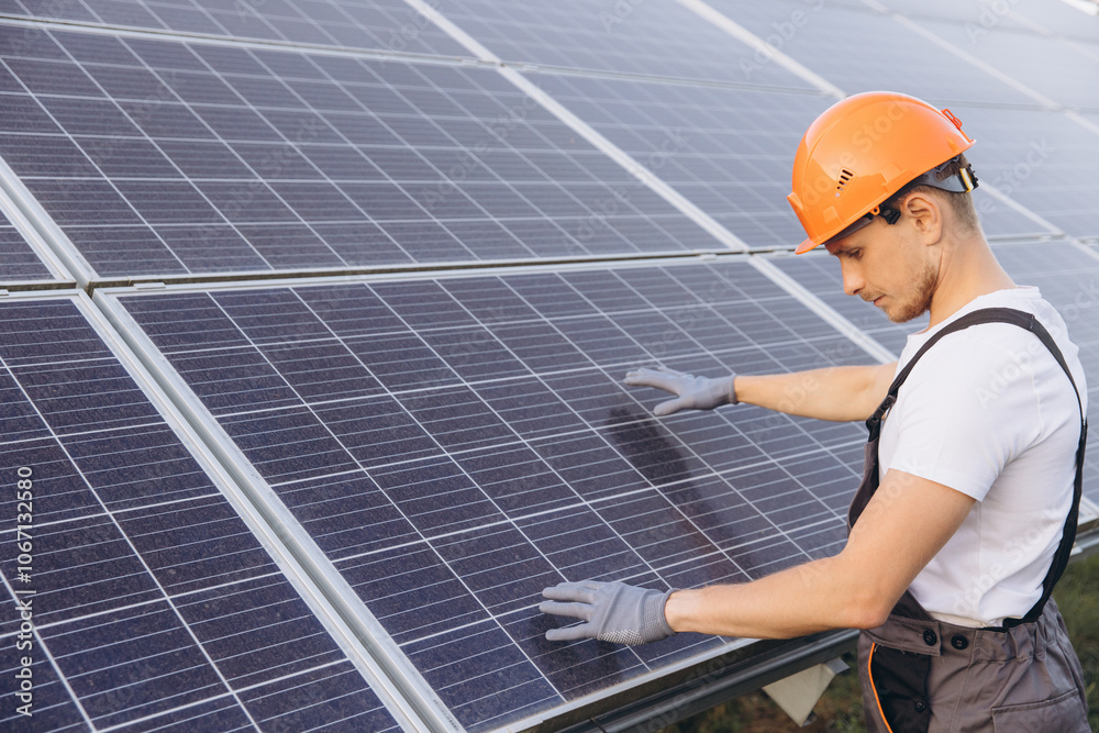 Engineer Inspecting Solar Panels on a Sunny Day Engineer Inspecting Solar Panels on a Sunny Day