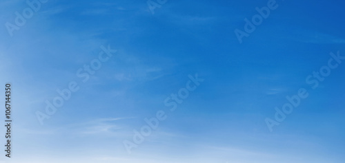 A blue sky with clouds. The sky is very clear and bright