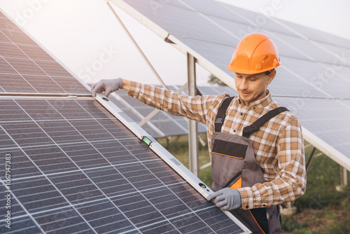 Engineer Inspecting Solar Panel Installation at Solar Farm