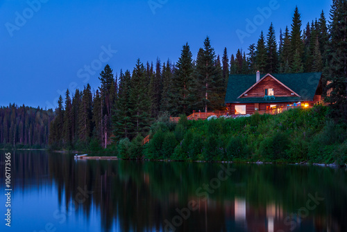 Luxury cabin with nice Summer lake view and forest landscape in Vancouver, Canada, North America. Night time on June 2024. photo