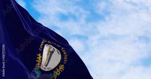 The US state flag of Kentucky waving on a clear day photo