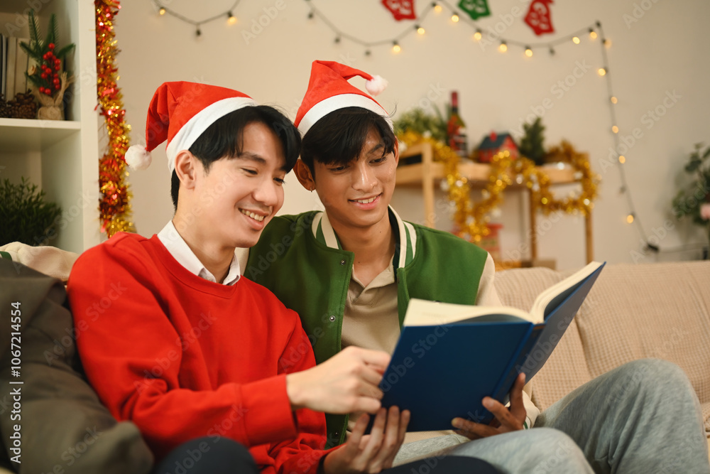 A Cozy Christmas Storytime for a Loving Gay Couple sits close, sharing a festive moment as they read from a book together, surrounded by Christmas decorations that fill the room with warmth A Cozy Christmas Storytime for a Loving Gay Couple sits close, sharing a festive moment as they read from a book together, surrounded by Christmas decorations that fill the room with warmth