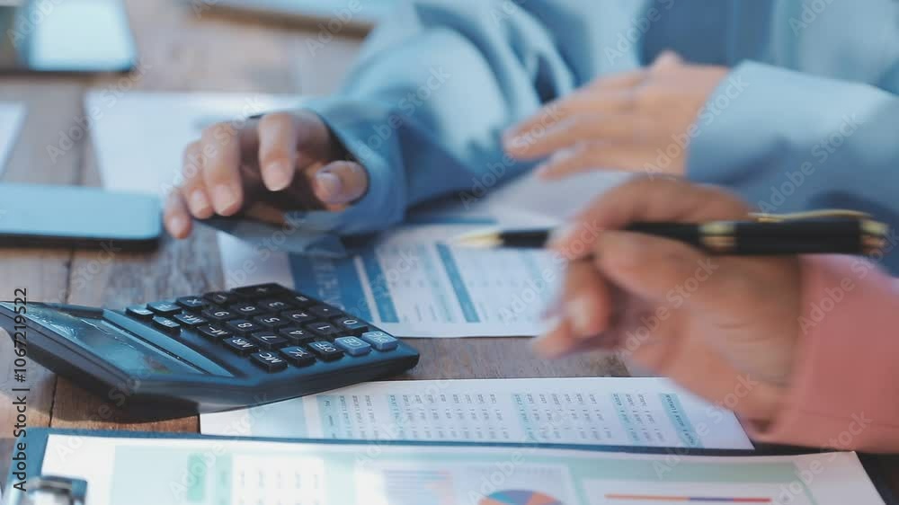 Accounting company provide finance and taxation planning for profitable cash flow, Auditor and accountant team working in office, analyze financial data and accounting record with calculator.Insight Accounting company provide finance and taxation planning for profitable cash flow, Auditor and accountant team working in office, analyze financial data and accounting record with calculator.Insight