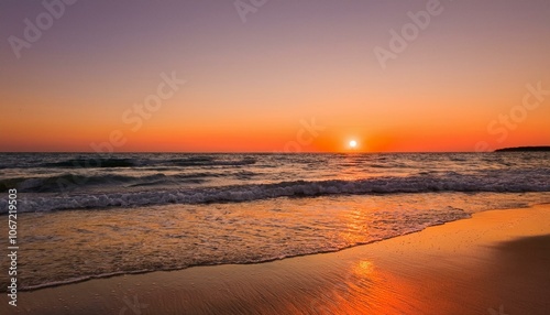 Waves on the beach at red sunset