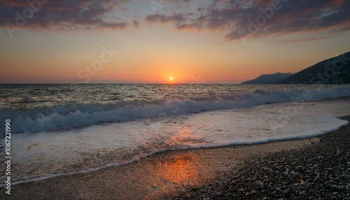 Waves on the beach at red sunset