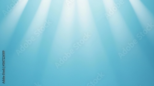 A serene blue background with soft light rays creating a peaceful and calming atmosphere, perfect for various creative projects and designs.